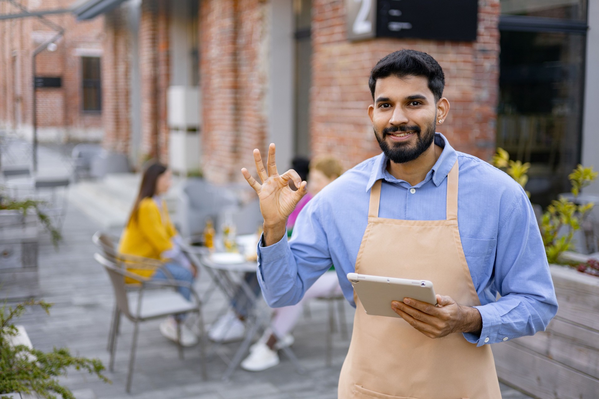Hindu Waiter with Tablet